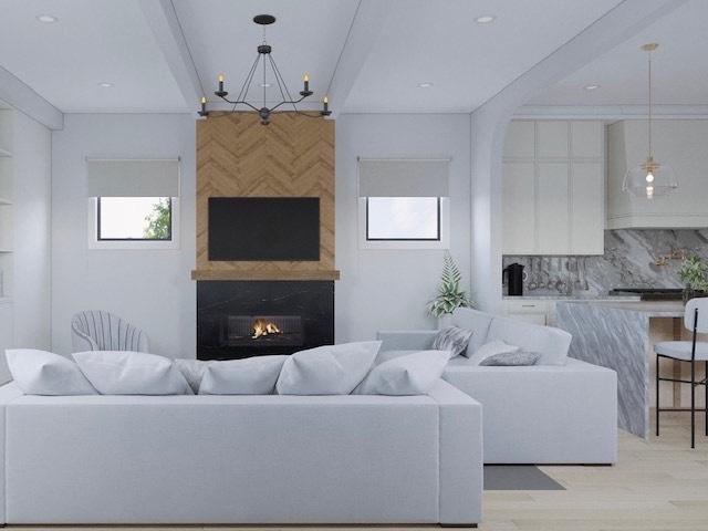 2203 W Huron Ave, Chicago, IL 60622 - living area with light wood finished floors, a glass covered fireplace, and a chandelier