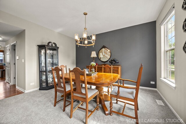 854 Preston Ln, Oswego, IL 60543 - carpeted dining room featuring plenty of natural light and a chandelier