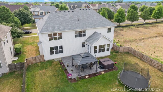 854 Preston Ln, Oswego, IL 60543 - rear view of house featuring a gazebo, a patio area, a residential view, a shingled roof, and a fenced backyard