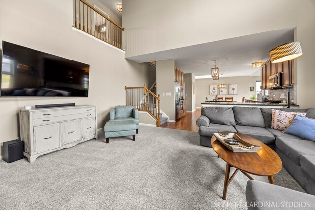 854 Preston Ln, Oswego, IL 60543 - carpeted living area featuring stairs and a high ceiling
