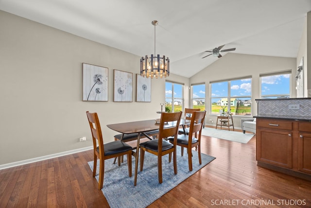 854 Preston Ln, Oswego, IL 60543 - dining space featuring a chandelier, wood-type flooring, a ceiling fan, and high vaulted ceiling