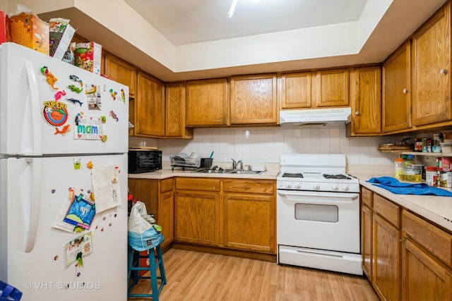 1107 E Algonquin Rd Unit 19, Arlington Heights, IL 60005 - kitchen with white appliances, under cabinet range hood, light countertops, and light wood finished floors