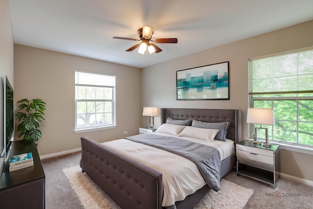 1186 Ballantrae Pl Unit D, Mundelein, IL 60060 - bedroom with light colored carpet, multiple windows, and ceiling fan