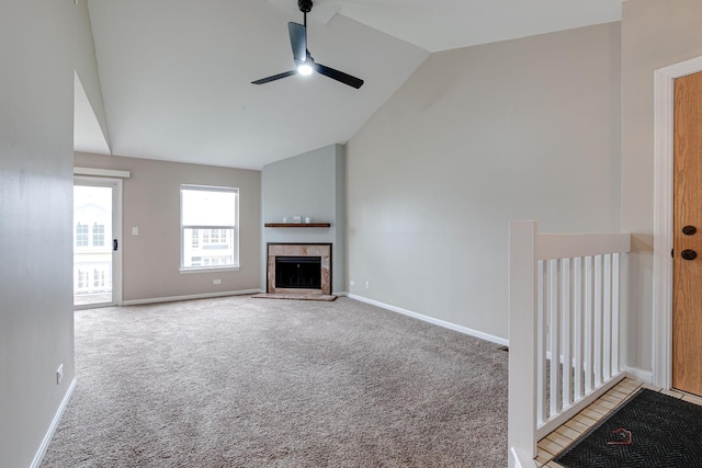 1186 Ballantrae Pl Unit D, Mundelein, IL 60060 - unfurnished living room with ceiling fan, carpet flooring, a fireplace, and high vaulted ceiling