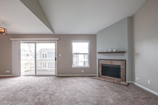1186 Ballantrae Pl Unit D, Mundelein, IL 60060 - unfurnished living room with carpet flooring, healthy amount of natural light, a premium fireplace, and vaulted ceiling