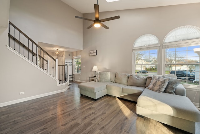 5462 Ridge Xing, Hanover Park, IL 60133 - living area with stairs, dark wood finished floors, a towering ceiling, and ceiling fan