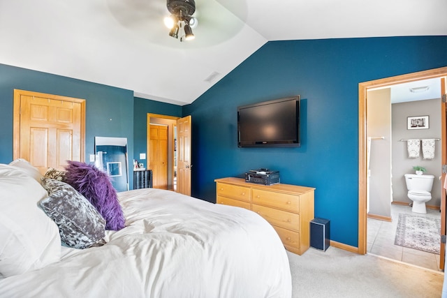 2551 Fallbrook Dr, Hampshire, IL 60140 - carpeted bedroom featuring lofted ceiling, connected bathroom, and a ceiling fan
