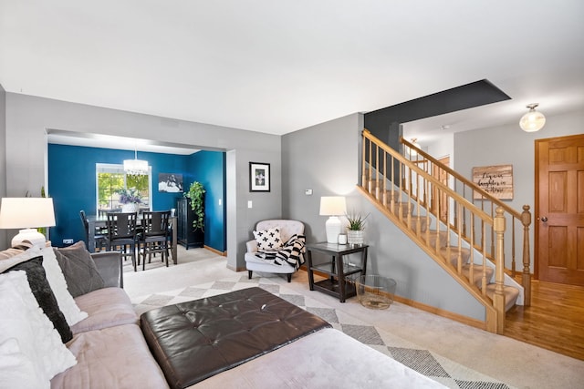 2551 Fallbrook Dr, Hampshire, IL 60140 - carpeted living area with stairs and baseboards