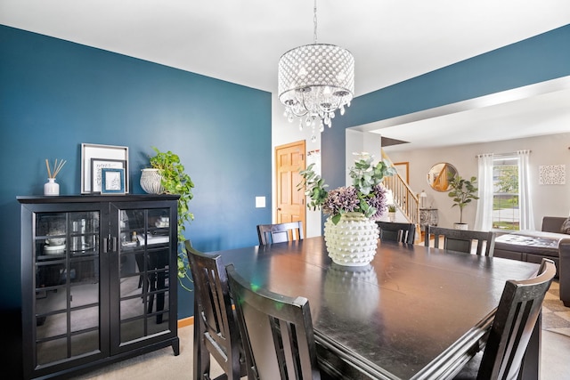 2551 Fallbrook Dr, Hampshire, IL 60140 - dining area with stairs and a chandelier