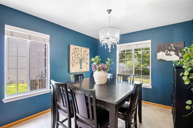 2551 Fallbrook Dr, Hampshire, IL 60140 - dining area with a chandelier, carpet flooring, and healthy amount of natural light