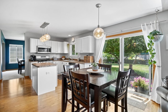 2551 Fallbrook Dr, Hampshire, IL 60140 - dining room with light wood-style flooring
