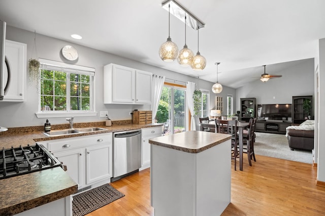 2551 Fallbrook Dr, Hampshire, IL 60140 - kitchen with dishwasher, a center island, white cabinetry, a ceiling fan, and light wood finished floors