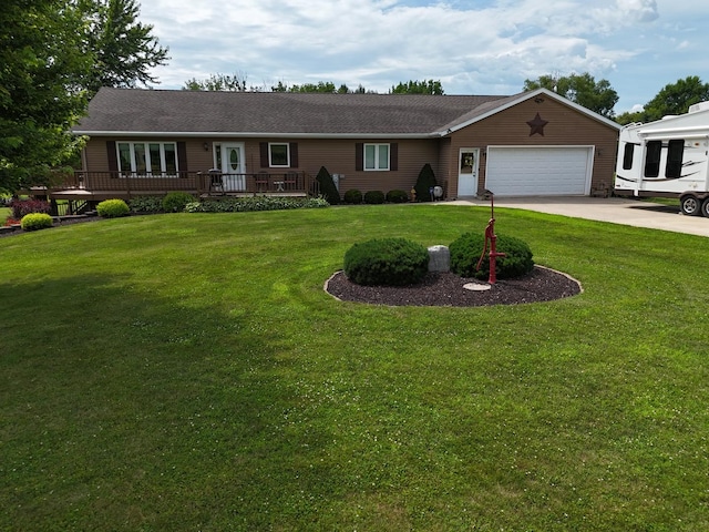 5782 N Brown Rd, Dakota, IL 61018 - single story home featuring a garage, a front lawn, a deck, driveway, and french doors