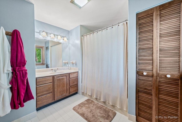 335 Arlington Rd, Itasca, IL 60143 - full bathroom with vanity, a closet, tile patterned flooring, and shower / bath combo