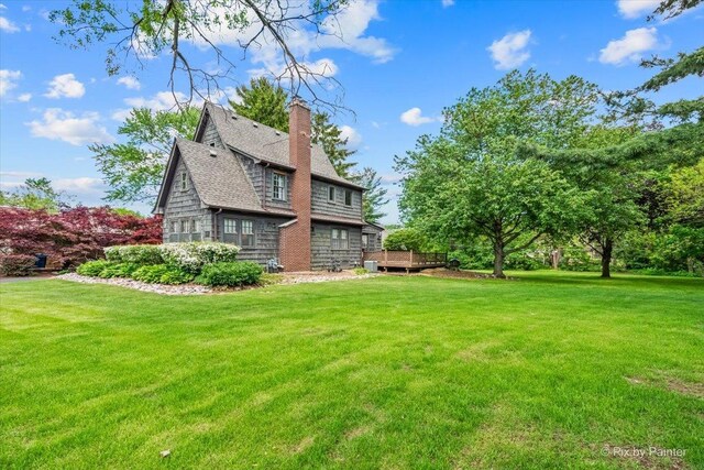 335 Arlington Rd, Itasca, IL 60143 - back of house with a chimney, a yard, a deck, and a shingled roof