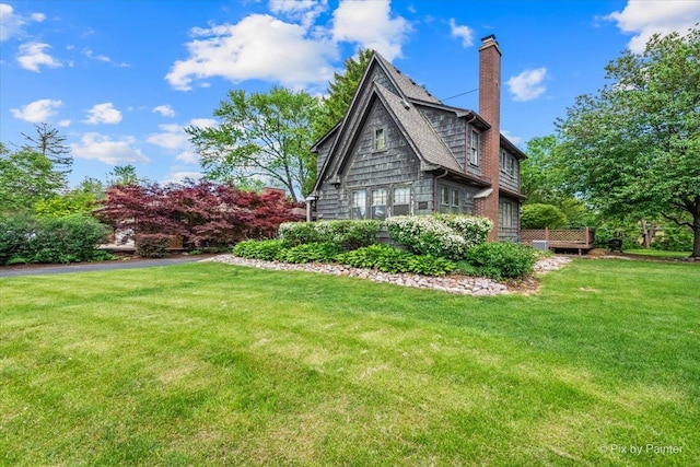 335 Arlington Rd, Itasca, IL 60143 - view of side of home with a chimney and a yard