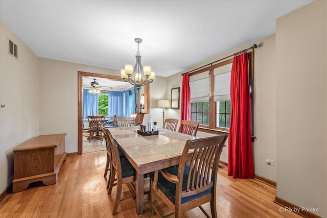 335 Arlington Rd, Itasca, IL 60143 - dining area with a chandelier and light wood-style flooring