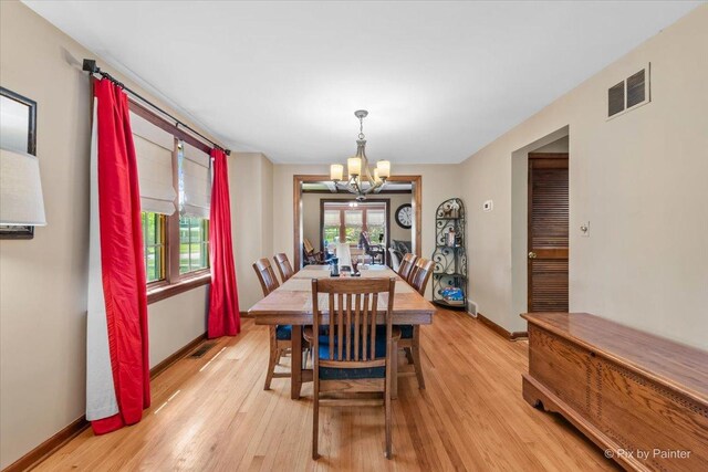 335 Arlington Rd, Itasca, IL 60143 - dining room with a chandelier and light wood-type flooring