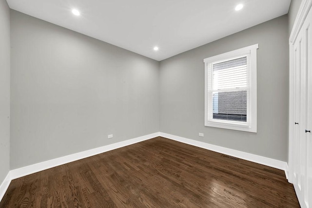 5414 W Haddon Ave, Chicago, IL 60651 - empty room featuring dark wood-style flooring and recessed lighting