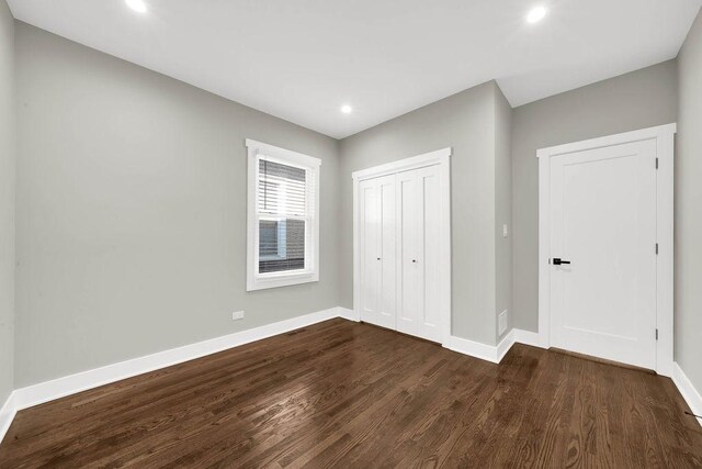 5414 W Haddon Ave, Chicago, IL 60651 - unfurnished bedroom featuring dark wood-style flooring, a closet, and recessed lighting