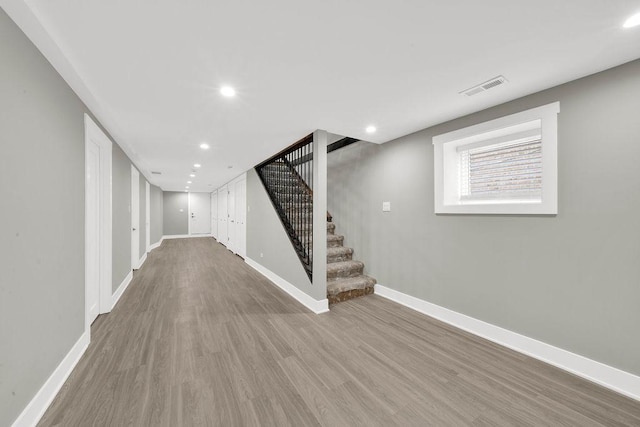 5414 W Haddon Ave, Chicago, IL 60651 - basement featuring wood finished floors, stairs, and recessed lighting
