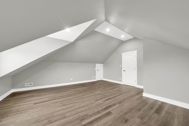 5414 W Haddon Ave, Chicago, IL 60651 - additional living space with lofted ceiling, recessed lighting, and wood finished floors