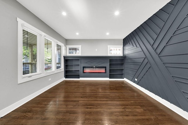 5414 W Haddon Ave, Chicago, IL 60651 - unfurnished living room with a glass covered fireplace, wood finished floors, and recessed lighting