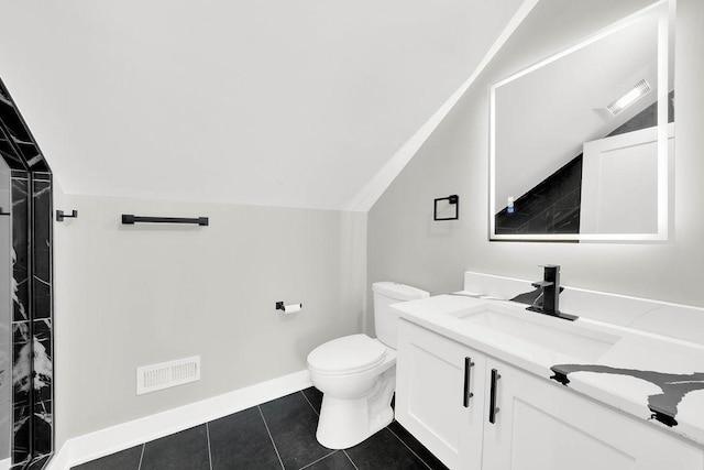 5414 W Haddon Ave, Chicago, IL 60651 - bathroom featuring vanity, vaulted ceiling, and tile patterned floors