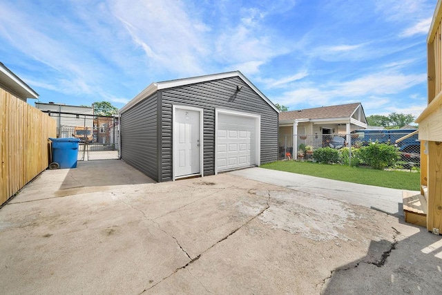 5414 W Haddon Ave, Chicago, IL 60651 - detached garage featuring a gate and concrete driveway