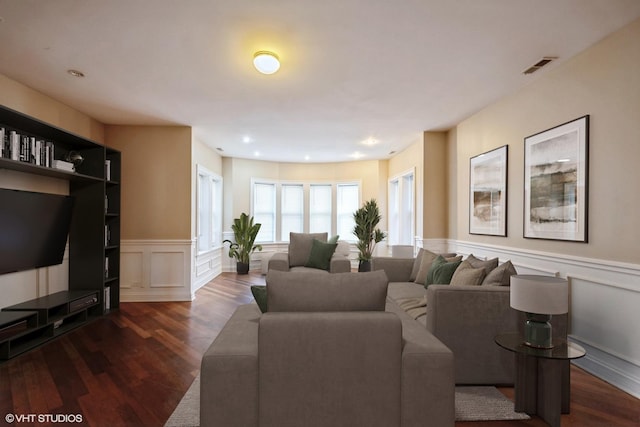 7018 S Paxton Ave Unit 3N, Chicago, IL 60649 - living room featuring a decorative wall, dark wood-type flooring, wainscoting, and recessed lighting