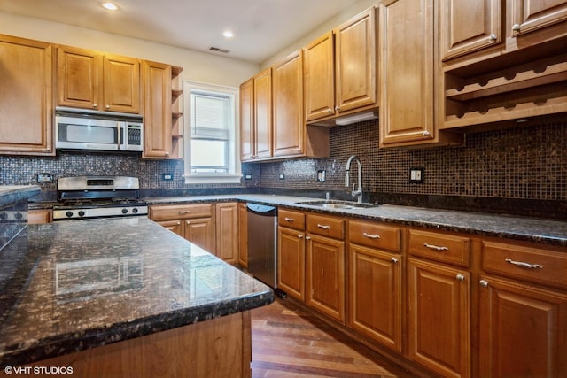 7018 S Paxton Ave Unit 3N, Chicago, IL 60649 - kitchen featuring appliances with stainless steel finishes, open shelves, dark wood finished floors, tasteful backsplash, and dark stone counters