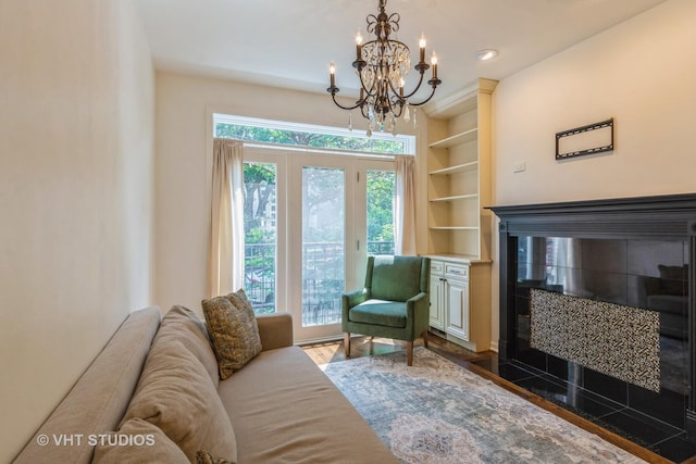 1302 N Bosworth Ave Unit 1, Chicago, IL 60642 - living room featuring a chandelier, a fireplace with flush hearth, wood finished floors, and built in features