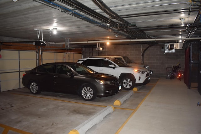 13058 Laurel Glen Ct Unit 203, Palos Heights, IL 60463 - parking garage with a garage door opener and concrete block wall
