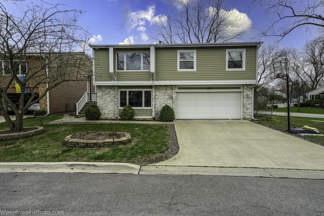 101 Croftwood Ct, Rolling Meadows, IL 60008 - view of front of property featuring a garage, driveway, and a front lawn