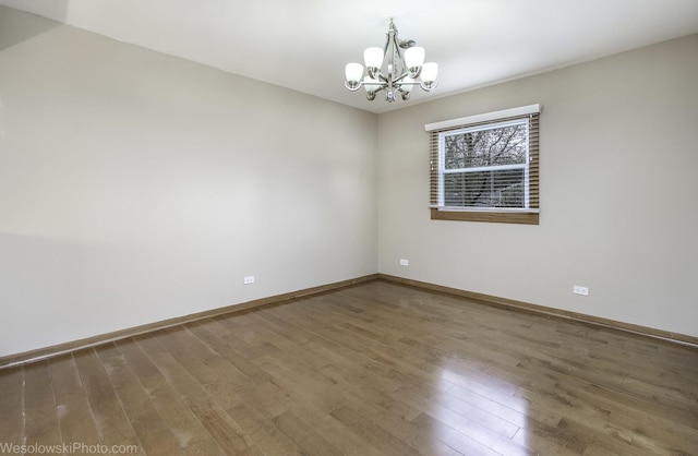 101 Croftwood Ct, Rolling Meadows, IL 60008 - empty room with a chandelier and wood finished floors