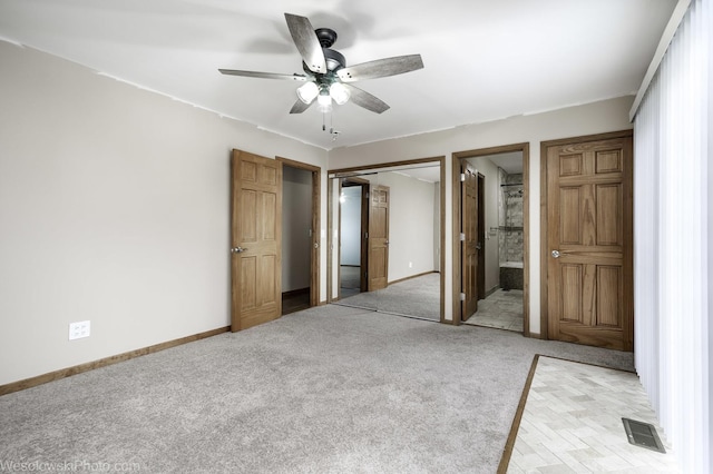 101 Croftwood Ct, Rolling Meadows, IL 60008 - unfurnished bedroom with light colored carpet, a closet, ensuite bathroom, and ceiling fan