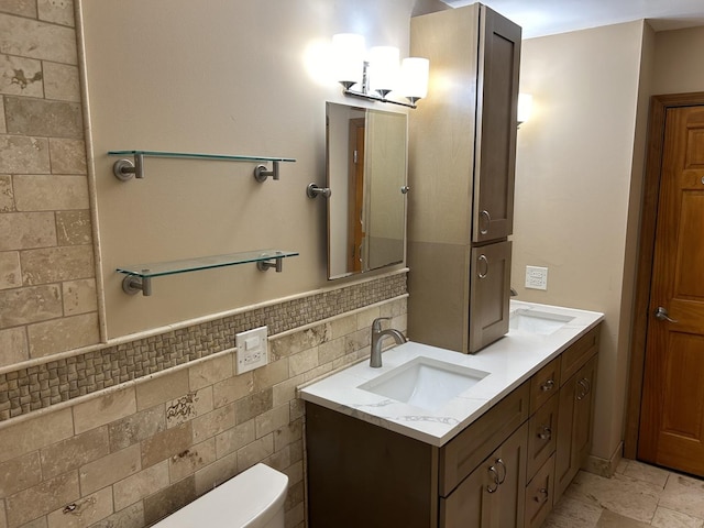 101 Croftwood Ct, Rolling Meadows, IL 60008 - full bathroom with double vanity, tile walls, and a wainscoted wall