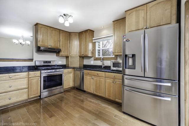 101 Croftwood Ct, Rolling Meadows, IL 60008 - kitchen with stainless steel appliances, under cabinet range hood, dark wood-style flooring, a chandelier, and dark stone countertops
