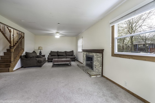 101 Croftwood Ct, Rolling Meadows, IL 60008 - carpeted living room featuring stairs, ceiling fan, and a stone fireplace