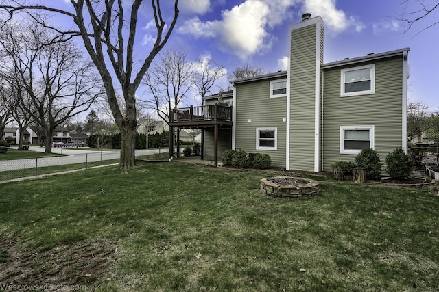 101 Croftwood Ct, Rolling Meadows, IL 60008 - rear view of house with a fire pit, a wooden deck, and a chimney