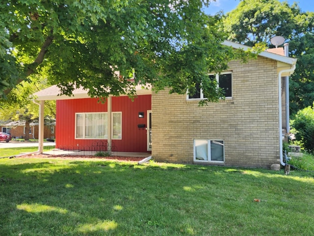 392 Jan Dr, Manteno, IL 60950 - view of front of home featuring a front lawn and brick siding