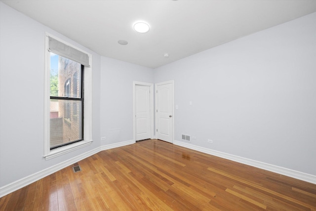 1363 E 64th St Unit 1, Chicago, IL 60637 - empty room featuring baseboards and light wood-type flooring