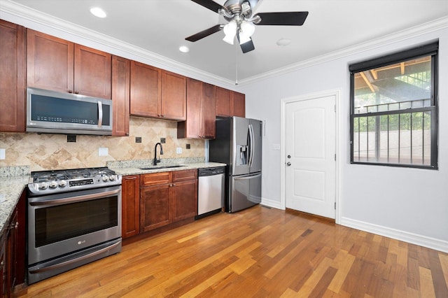 1363 E 64th St Unit 1, Chicago, IL 60637 - kitchen with stainless steel appliances, light wood-type flooring, backsplash, a ceiling fan, and light stone countertops