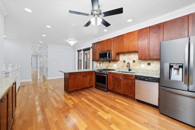 1363 E 64th St Unit 1, Chicago, IL 60637 - kitchen featuring stainless steel appliances, a ceiling fan, tasteful backsplash, a peninsula, and light wood-style flooring