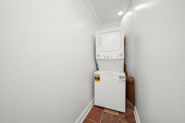 1363 E 64th St Unit 1, Chicago, IL 60637 - laundry area with stacked washer / dryer, crown molding, and dark tile patterned floors