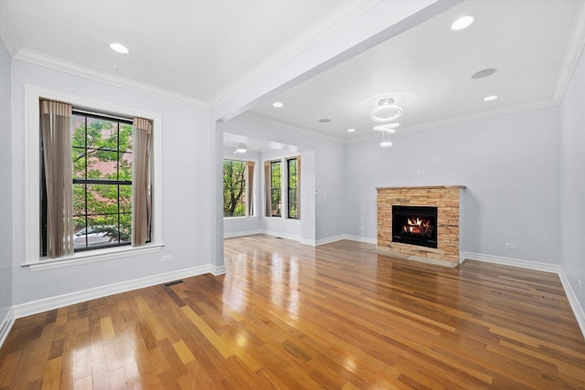 1363 E 64th St Unit 1, Chicago, IL 60637 - unfurnished living room featuring wood-type flooring, plenty of natural light, a fireplace, ornamental molding, and recessed lighting