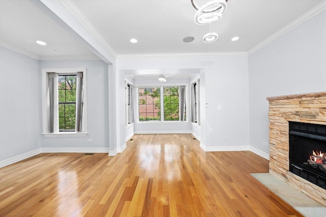 1363 E 64th St Unit 1, Chicago, IL 60637 - unfurnished living room with plenty of natural light, light wood-style floors, a fireplace, and crown molding