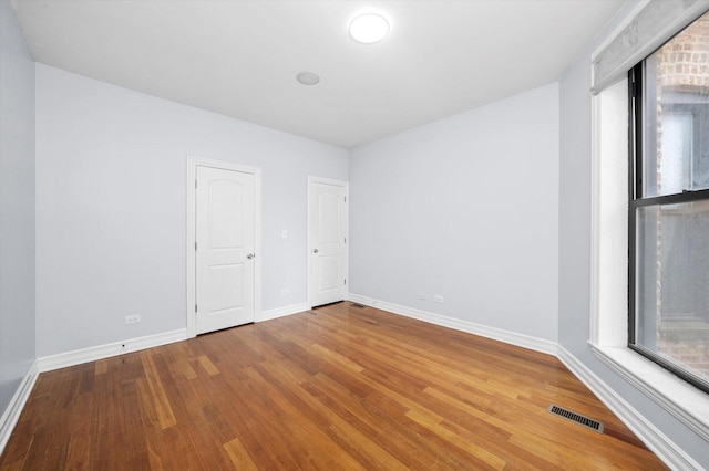 1363 E 64th St Unit 1, Chicago, IL 60637 - unfurnished room featuring wood finished floors and baseboards