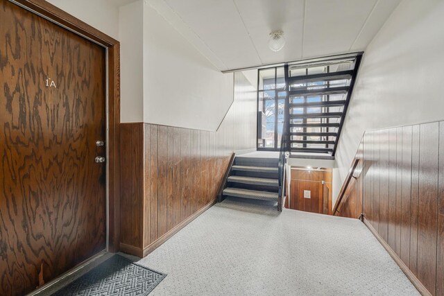 5715 129th St Unit 1A, Crestwood, IL 60418 - stairway featuring wooden walls, carpet floors, and a wainscoted wall