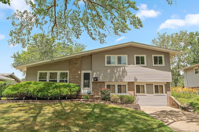 5754 150th St, Oak Forest, IL 60452 - tri-level home featuring a front lawn and brick siding